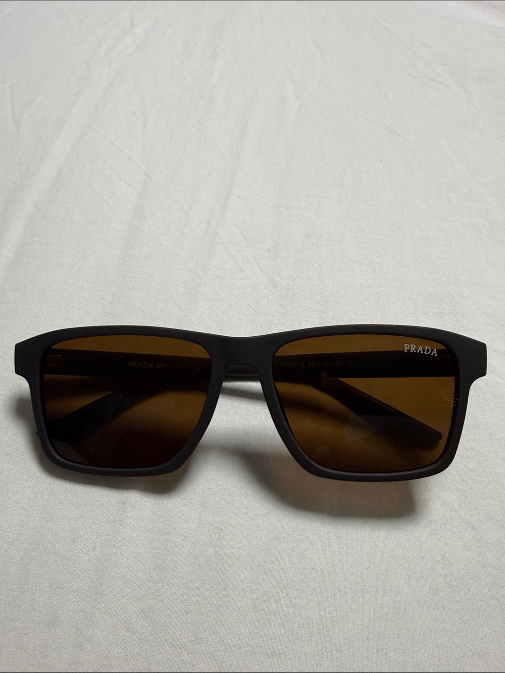 Prada Black Frame Sunglasses with Brown Lenses
